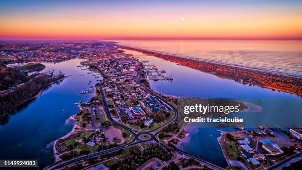 sunset over the township at lakes entrance - lakes entrance stock pictures, royalty-free photos & images