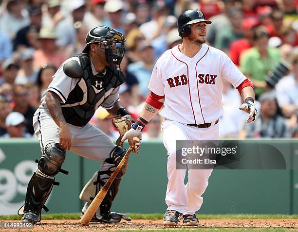 Jarrod Saltalamacchia of the Boston Red Sox gets 2 RBI on a hit in the second inning as Ramon Castro of the Chicago White Sox catches on June 1, 2011...