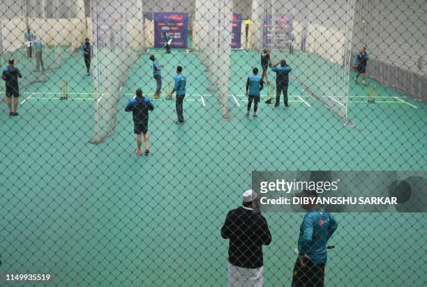 Pakistan's chairman of selectors Inzamam-ul-Haq speaks with Pakistan's head coach Mickey Arthur as players bat in the nets during an indoor training...