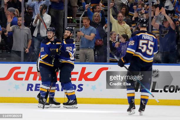 Tyler Bozak and Ryan O'Reilly of the St. Louis Blues celebrate with Colton Parayko after a goal scored on Martin Jones of the San Jose Sharks during...