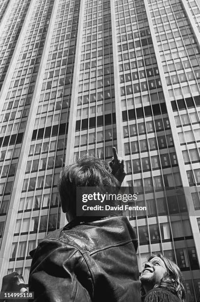 Protestor at a demonstration outside 100 Centre Street in support of the Black Panthers raises his middle finger in a gesture of defiance towards the...