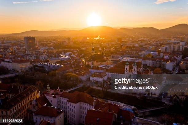 graz city center aerial sunset view - graz stock-fotos und bilder