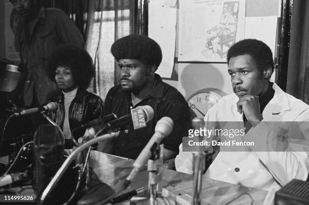 Black Panther Deputy Minister of Information Elbert "Big Man" Howard, center, and Black Panther Chief of Staff David Hilliard, right, hold a press...