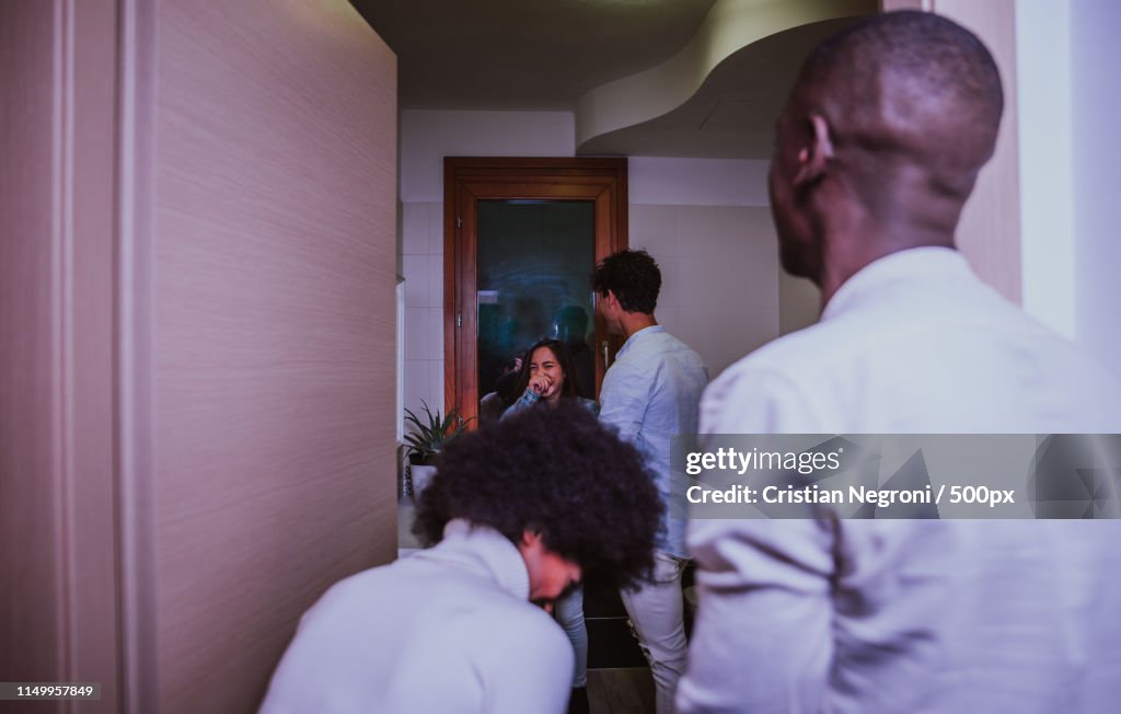 A Group Of Young People Celebrating And Making Party At Home