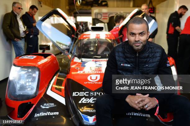 Former San Antonio Spurs basketball player Tony Parker poses in front of an Oreca 07 Gibson LMP2 car prior an interview, on June 14 at Le Mans...
