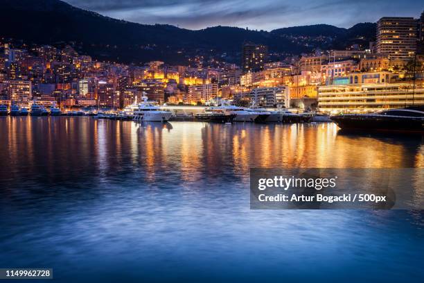 monaco evening skyline - monaco port stock pictures, royalty-free photos & images