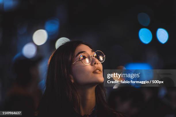 pretty asian woman portrait with led lights - people on colored background stock pictures, royalty-free photos & images