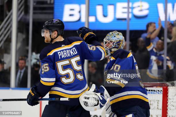 Colton Parayko and Jordan Binnington of the St. Louis Blues celebrate after defeating the San Jose Sharks with a score of 2 to 1 in Game Four of the...