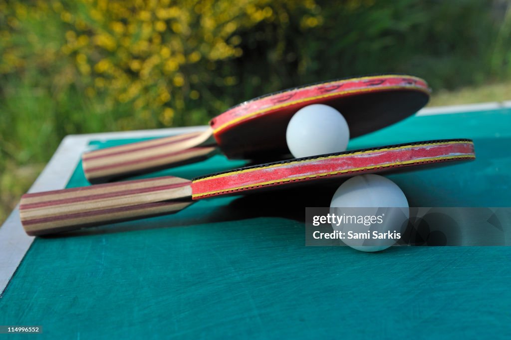 Table Tennis Racket and balls on table