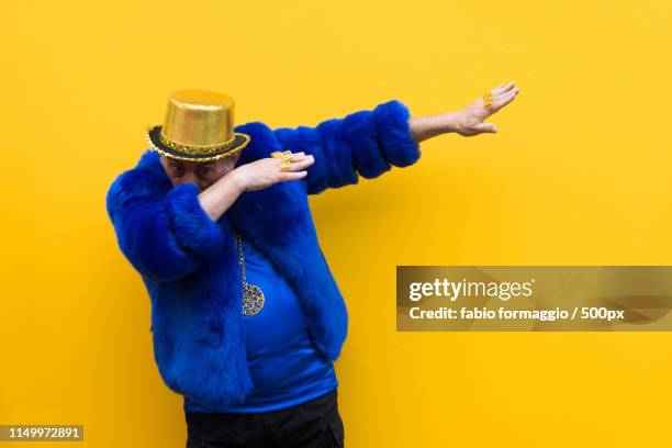 eccentric senior man portrait - dab dance stock pictures, royalty-free photos & images