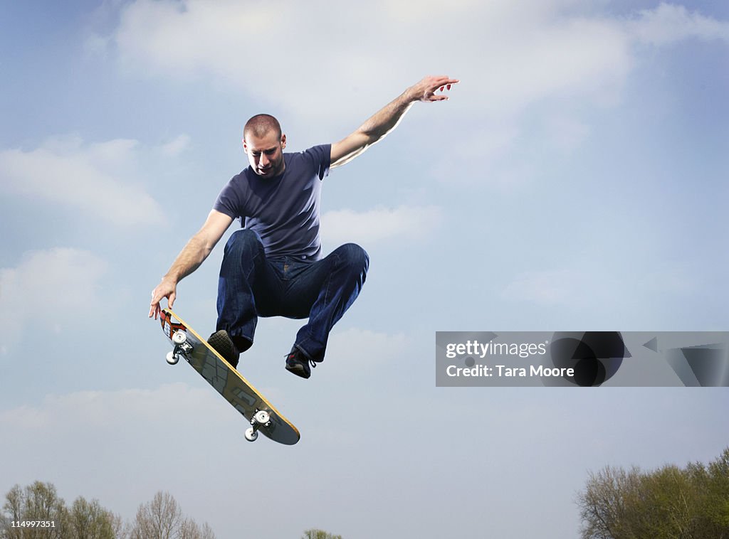 Man on skateboard in mid air