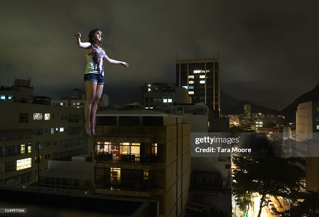 Woman Suspended In Mid Air In City High-Res Stock Photo - Getty Images