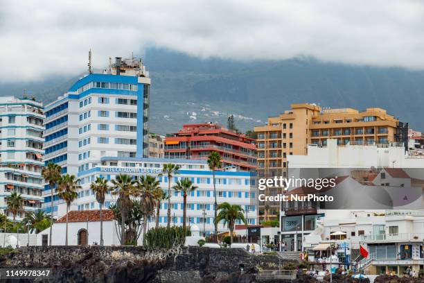 General view during a cloudy summer day of the seafront of the Atlantic Ocean in Puerto de la Cruz with Punta del Viento seaside coastal view, Playa...