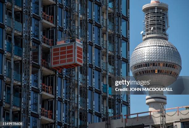 Construction site for a residential building is seen close to Berlin's TV Tower on June 14, 2019. A wave of gentrification and rising rents in the...