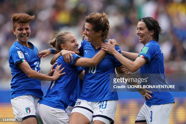 Italy's forward Cristiana Girelli is congratulated by teammates after scoring her third goal during the France 2019 Women's World Cup Group C...