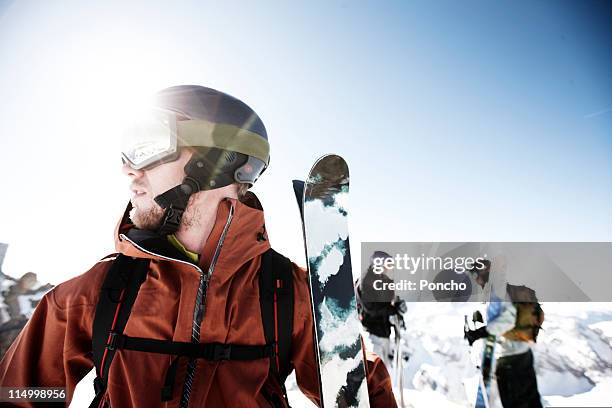 skier standing on mountain top of the marmolada - sports equipment foto e immagini stock