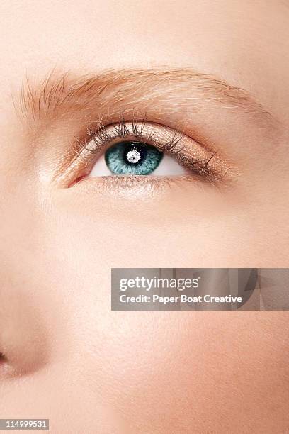 sharp close up of beautiful blue - green eyes - woman full frame stock pictures, royalty-free photos & images