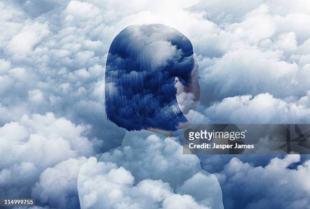 double exposure of woman looking in to clouds - dreamers stock-fotos und bilder