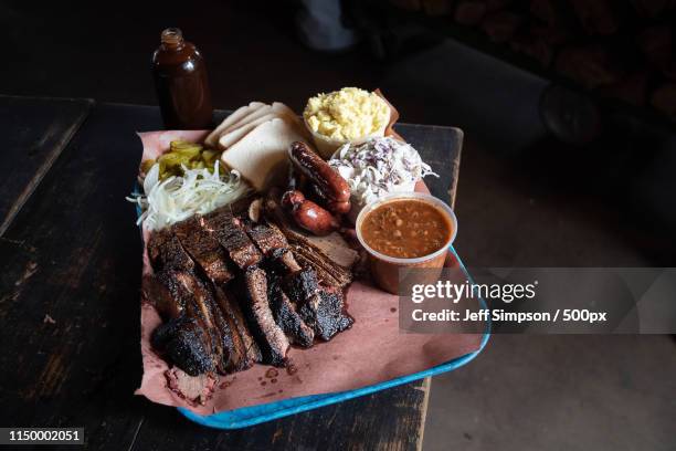 feast - texas bbq stock pictures, royalty-free photos & images