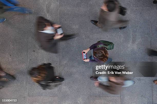 group with electronic devices in the street - people walking overhead view stock pictures, royalty-free photos & images