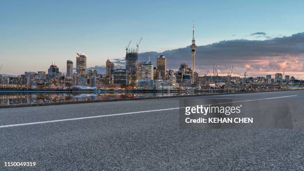 empty road with auckland city sunset view near seaside - cityscape dusk stock pictures, royalty-free photos & images