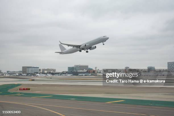 the airplane taking off los angeles international airport (lax) in california - lax airport stock pictures, royalty-free photos & images