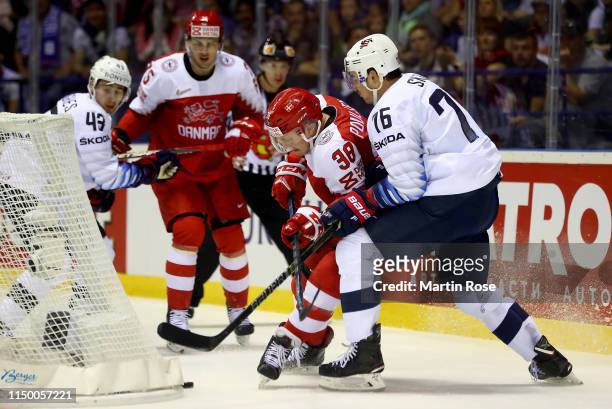 Morten Poulsen of Denmark challenges Brady Skjei of United States during the 2019 IIHF Ice Hockey World Championship Slovakia group A game between...