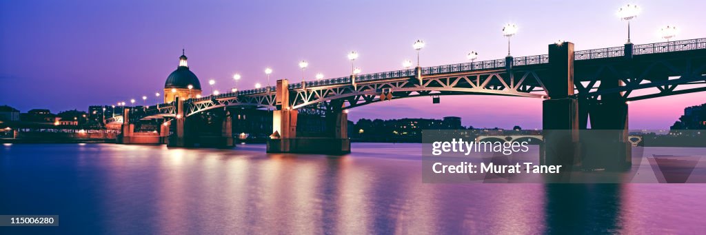 Illuminated bridge over a river