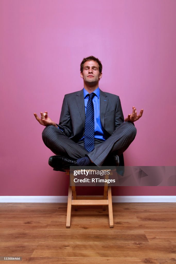 Businessman meditating