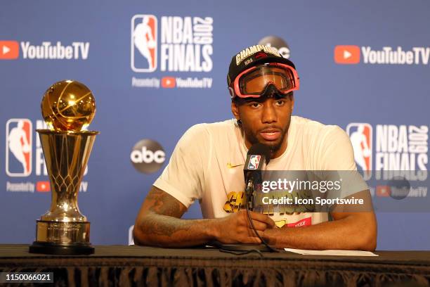 Kawhi Leonard of the Toronto Raptors appears with the Bill Russell NBA Finals MVP trophy following the conclusion of Toronto's 114-110 win over the...