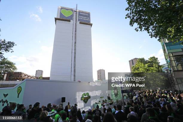 Family and friends of the 72 people who lost their lives in the Grenfell Tower block fire gather outside Grenfell Tower, London, for a wreath laying...