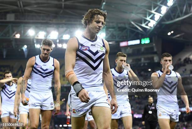 Nat Fyfe and his Dockers team mates look dejected after losing the round nine AFL match between the Essendon Bombers and the Fremantle Dockers at...