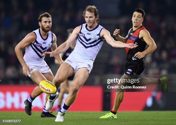 David Mundy of the Dockers kicks during the round nine AFL match between the Essendon Bombers and the Fremantle Dockers at Marvel Stadium on May 18,...