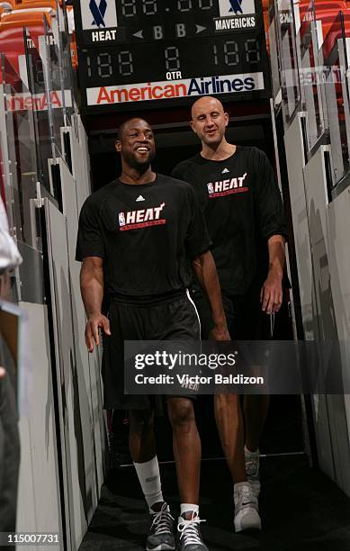 Dwyane Wade and Zydrunas Ilgauskas walk to the court during NBA Finals Media Availability on June 1, 2011 at American Airlines Arena in Miami,...