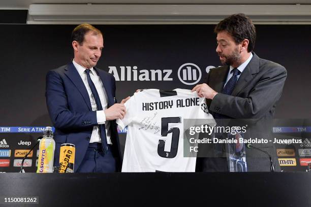 Juventus coach Massimiliano Allegri with chairman Andrea Agnelli pose with the jersey during a press conference at Allianz Stadium on May 18, 2019 in...