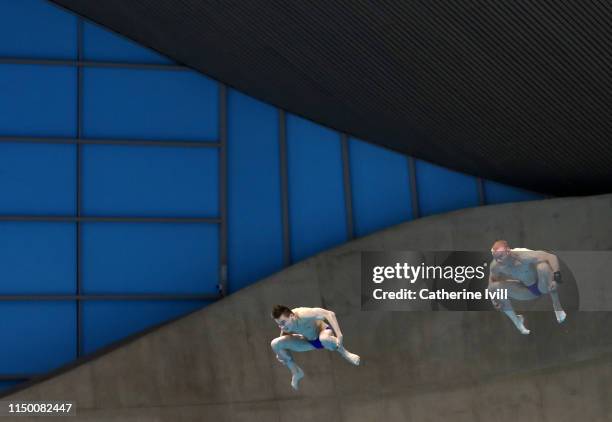 Evgeni Kuznetsov and Nikita Shleikher of Russia compete in the men's 3m Syncro springboard during Day One of the FINA/CNSG Diving World Series in the...