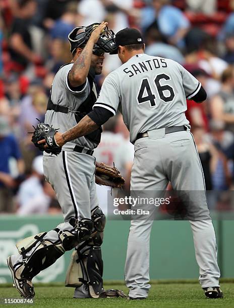 Ramon Castro of the Chicago White Sox celebrates the win with Sergio Santos after the game against the Boston Red Sox on June 1, 2011 at Fenway Park...