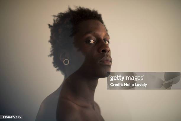 Portrait of a young man looking at camera