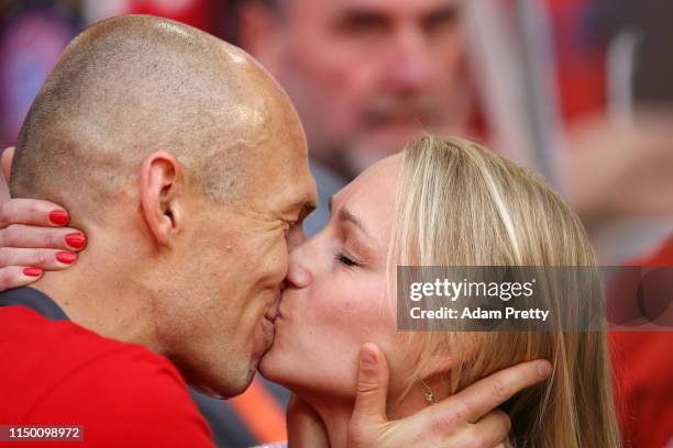 Arjen Robben of Bayern Munich kisses his wife Bernadien Eillert following the Bundesliga match between FC Bayern Muenchen and Eintracht Frankfurt at...