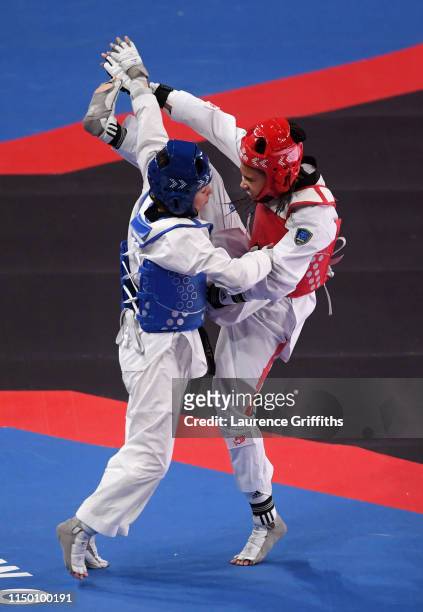 Aaliyah Powell of Great Britain in action against Oumaima El Bouchti of Morocco in the Quarter Final of the Womens -53kg during Day 4 of the World...