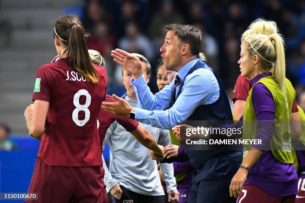 England's coach Phil Neville gives instructions to his players during the France 2019 Women's World Cup Group D football match between England and...