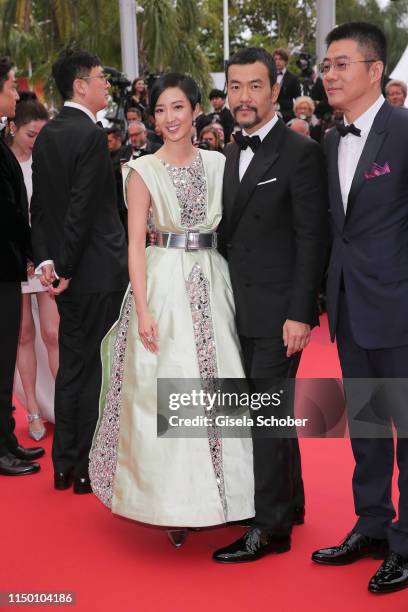 Gwei Lun-Mei and Liao Fan depart the screening of "The Wild Goose Lake " during the 72nd annual Cannes Film Festival on May 18, 2019 in Cannes,...