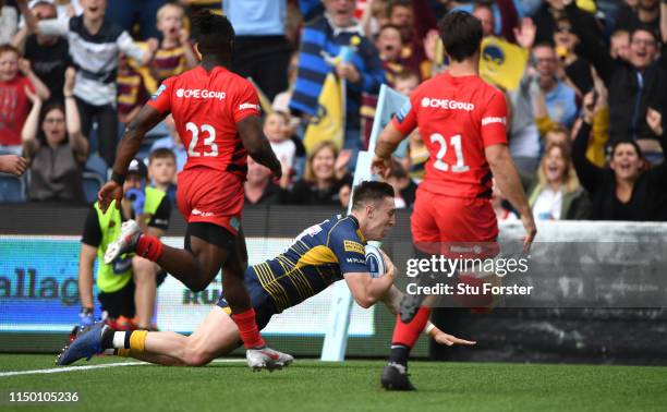 Warriors wing Josh Adams scores his try during the Gallagher Premiership Rugby match between Worcester Warriors and Saracens at Sixways Stadium on...