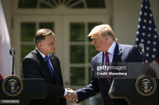 President Donald Trump, right, shakes hands with Andrzej Duda, Poland's president, during a news conference in the Rose Garden of the White House in...