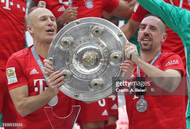 Arjen Robben and Franck Ribery of FC Bayern Muenchen celebrate the German Championship title after the Bundesliga match between FC Bayern Muenchen...