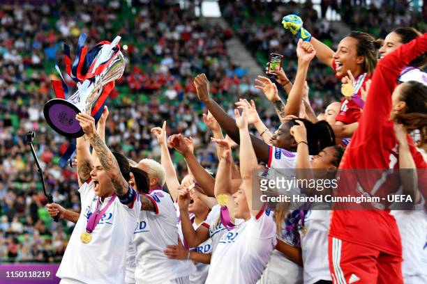 Dzsenifer Marozsan of Olympique Lyonnais Women lifts the trophy with her team after winning the UEFA Women's Champions League Final between Olympique...