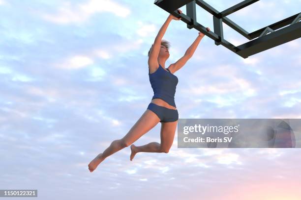 female athlete excercising chin-up on crane - brug turntoestel stockfoto's en -beelden