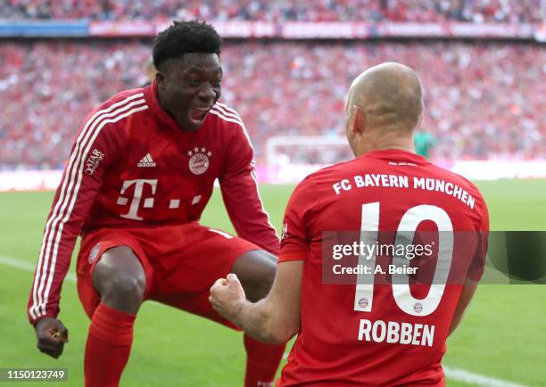 Arjen Robben of FC Bayern celebrates his goal with teammate Alphonso Davies during the Bundesliga match between FC Bayern Muenchen and Eintracht...