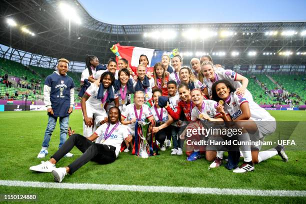 The Olympique Lyonnais Women team celebrate with the trophy after winning the UEFA Women's Champions League Final between Olympique Lyonnais Women...