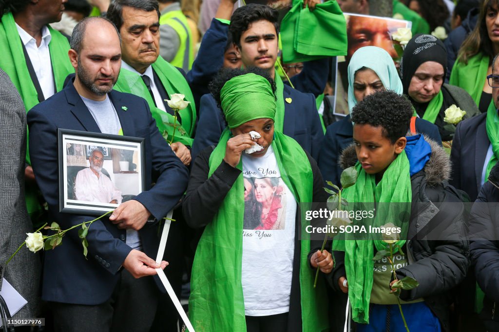 Survivors, family and friends of the victims wearing...